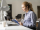 medium-shot-woman-sitting-desk